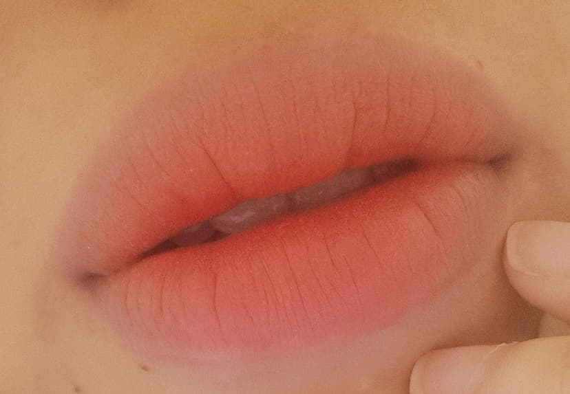 Four months post lipstick tattoo showing the subtle settled peach tint