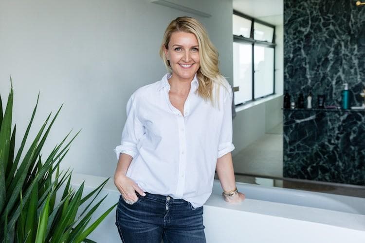 Stylist Claire Fabb posing for beauty editorial shoot, showcasing fresh, glowing complexion