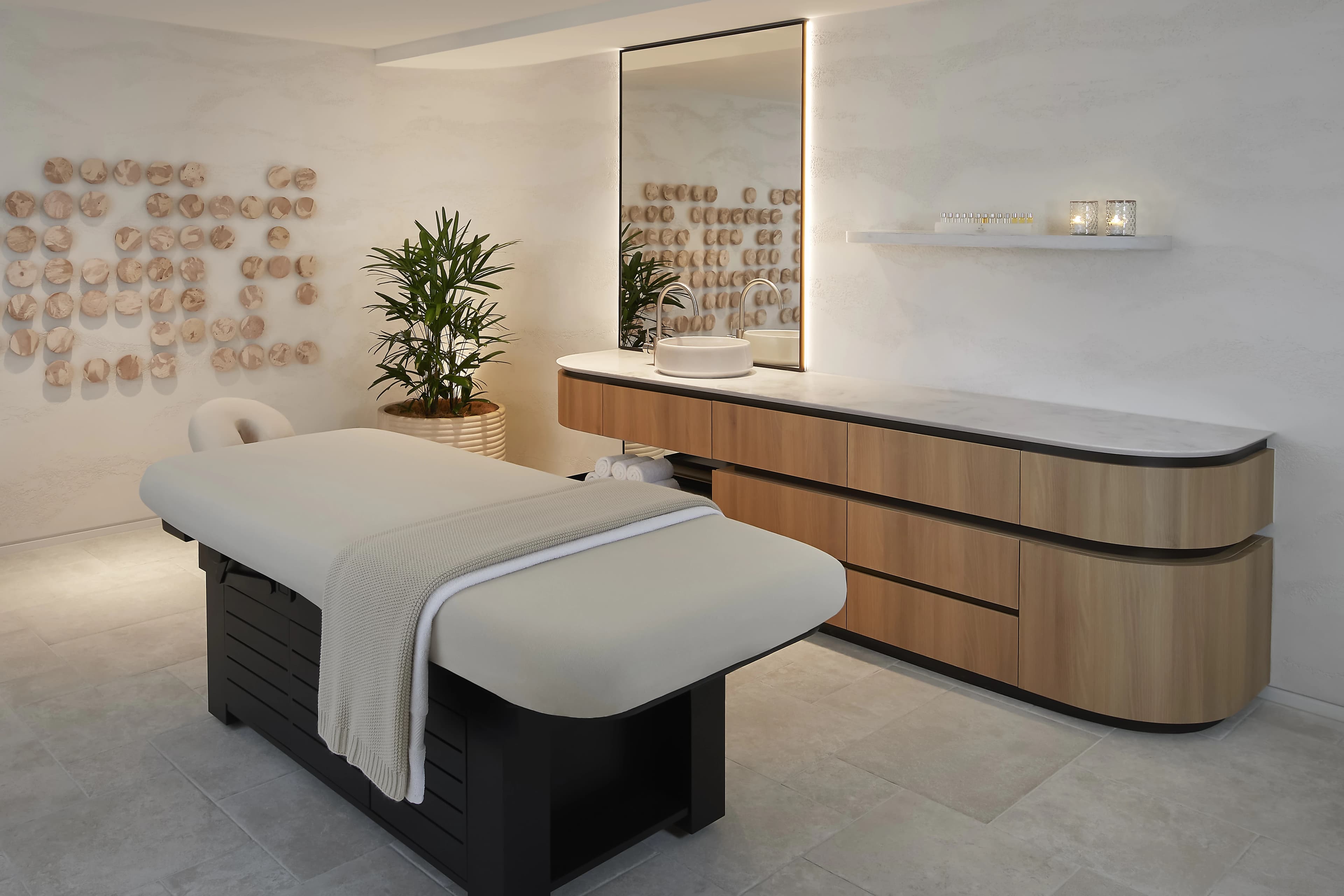 Relaxation lounge at Spa by JW, JW Marriott Gold Coast, with linen sheers, curved seating and courtyard views