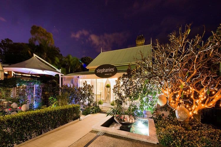 Victorian cottage exterior of Stephanie's Vintage Spa in Cleveland with manicured gardens and heritage architecture