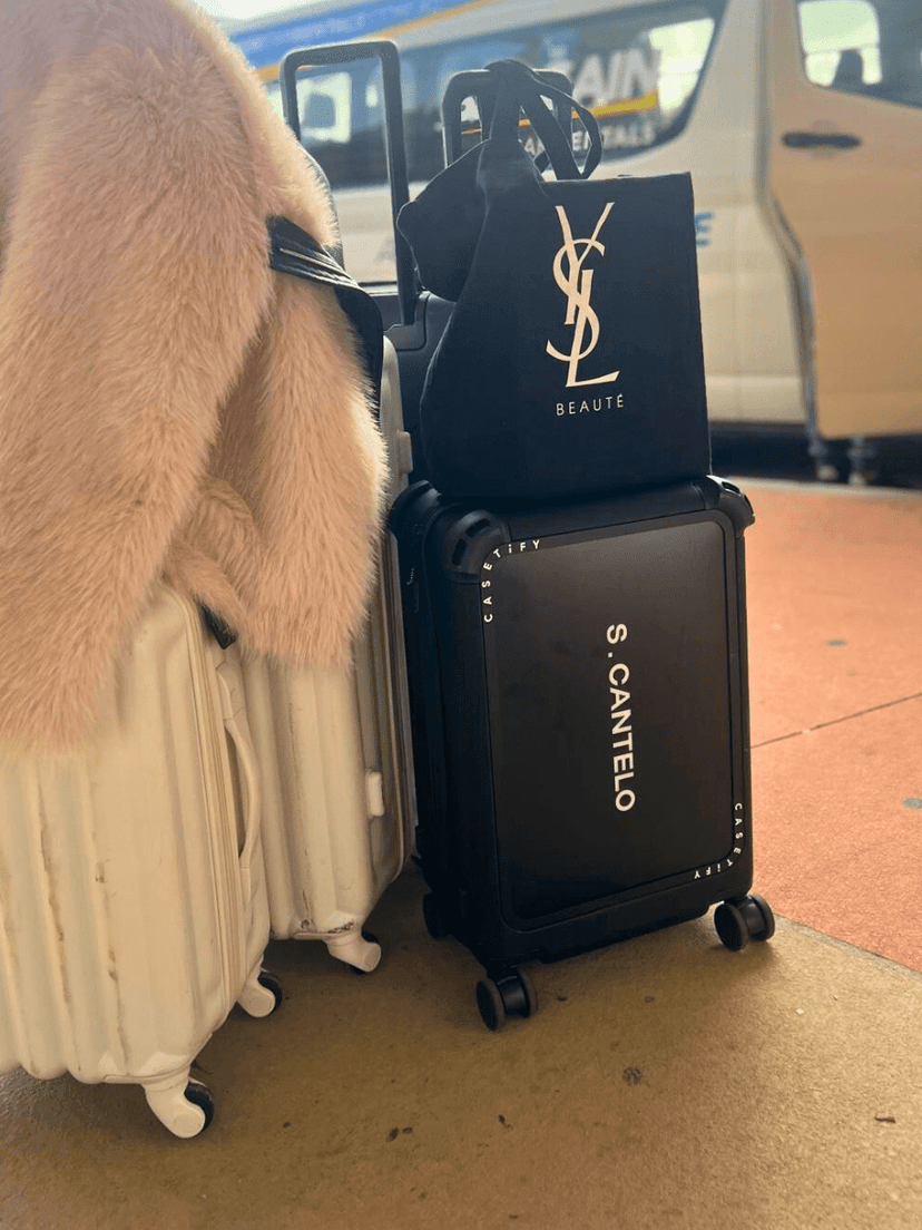 Travel essentials and luggage styled in a Mondrian Gold Coast suite
