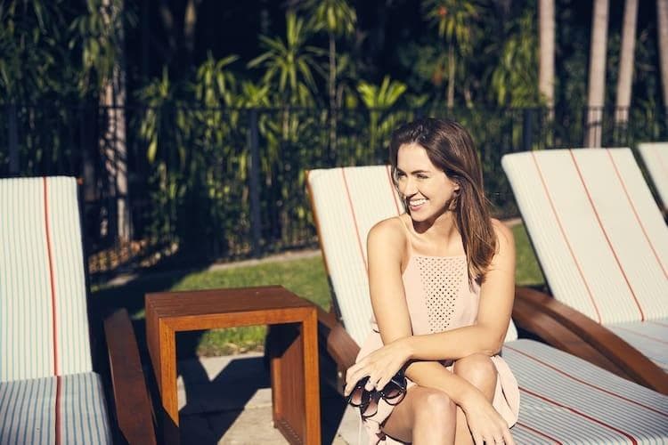 Sigourney Cantelo and Ole Henriksel at The Byron at Byron resort overlooking the pool in Byron Bay