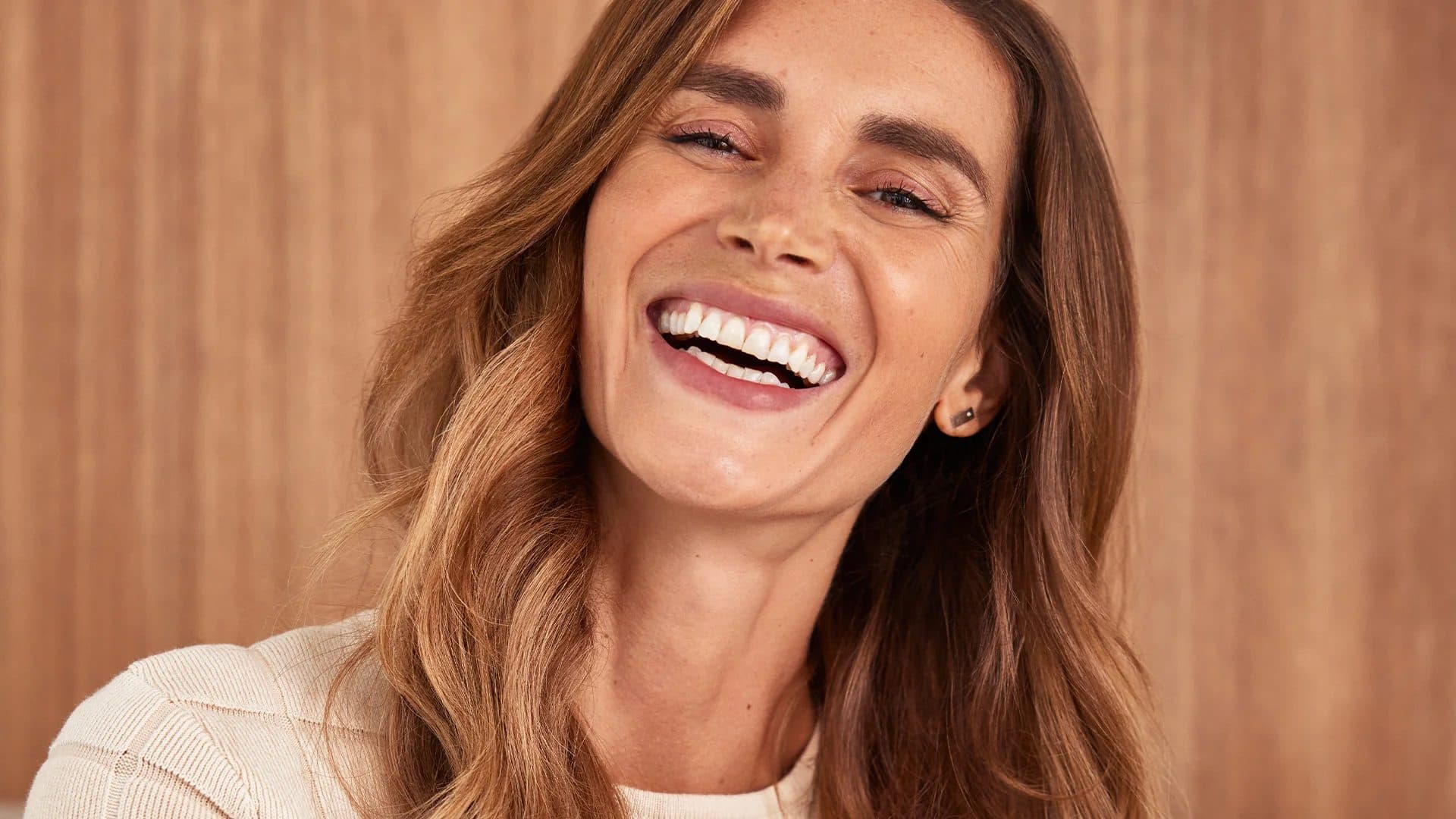 Sleep expert Olivia Arezzolo laughing in a warm close-up portrait, for Beautiful Inside by Beauticate