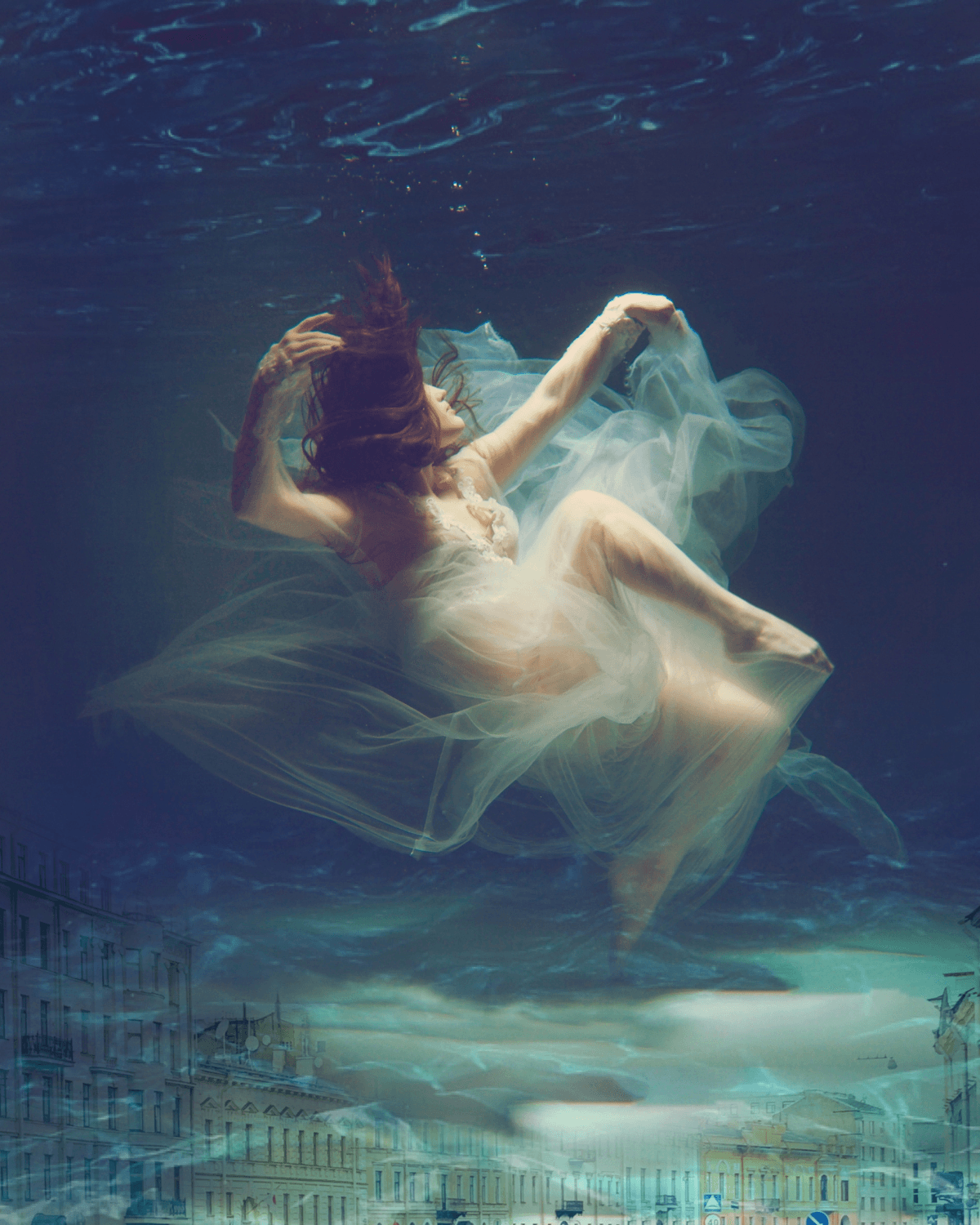 A serene breathwork session setting with soft lighting and a participant lying down in stillness