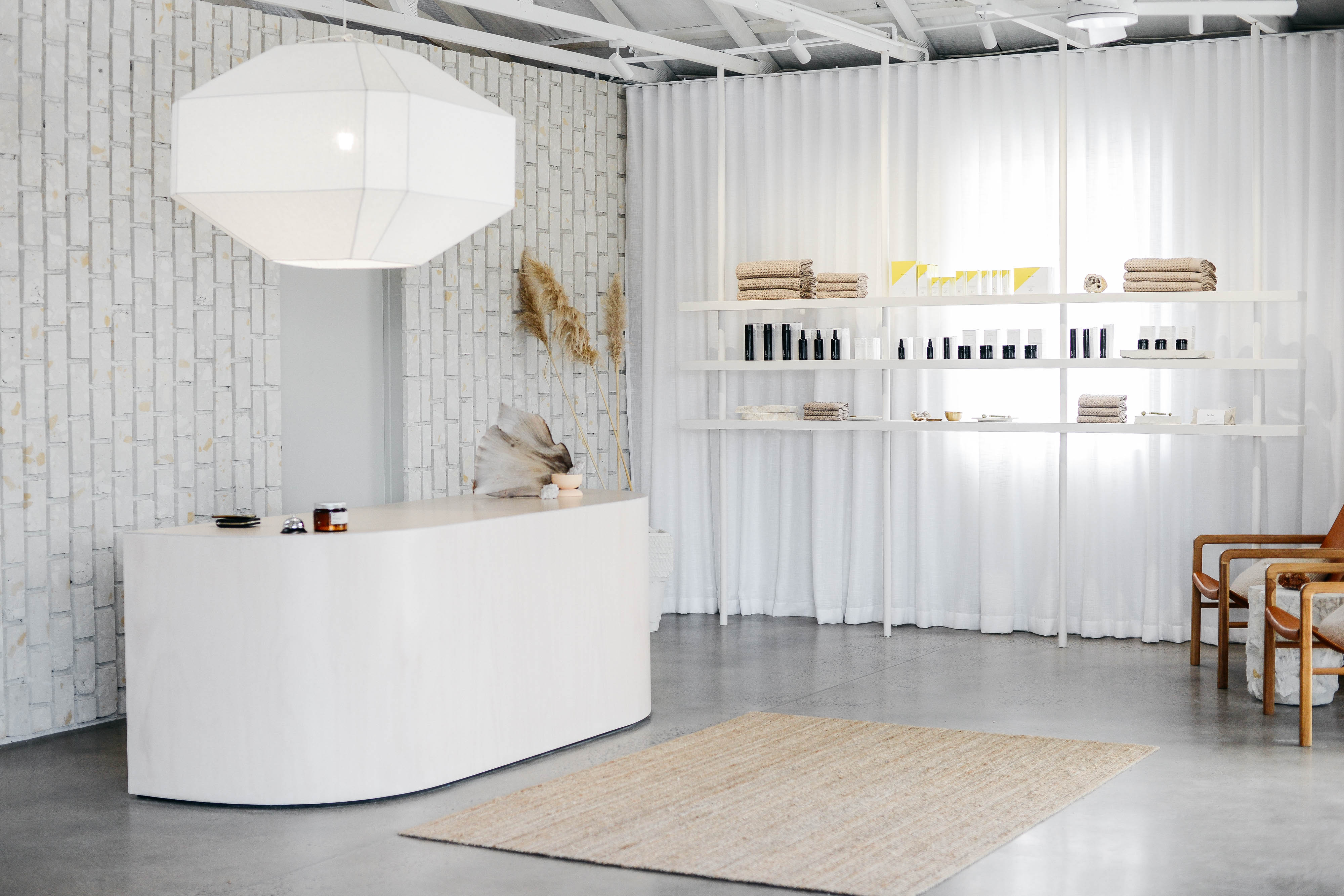 Little Company, Collingwood, skin studio in a heritage warehouse with textured stone and reclaimed timber