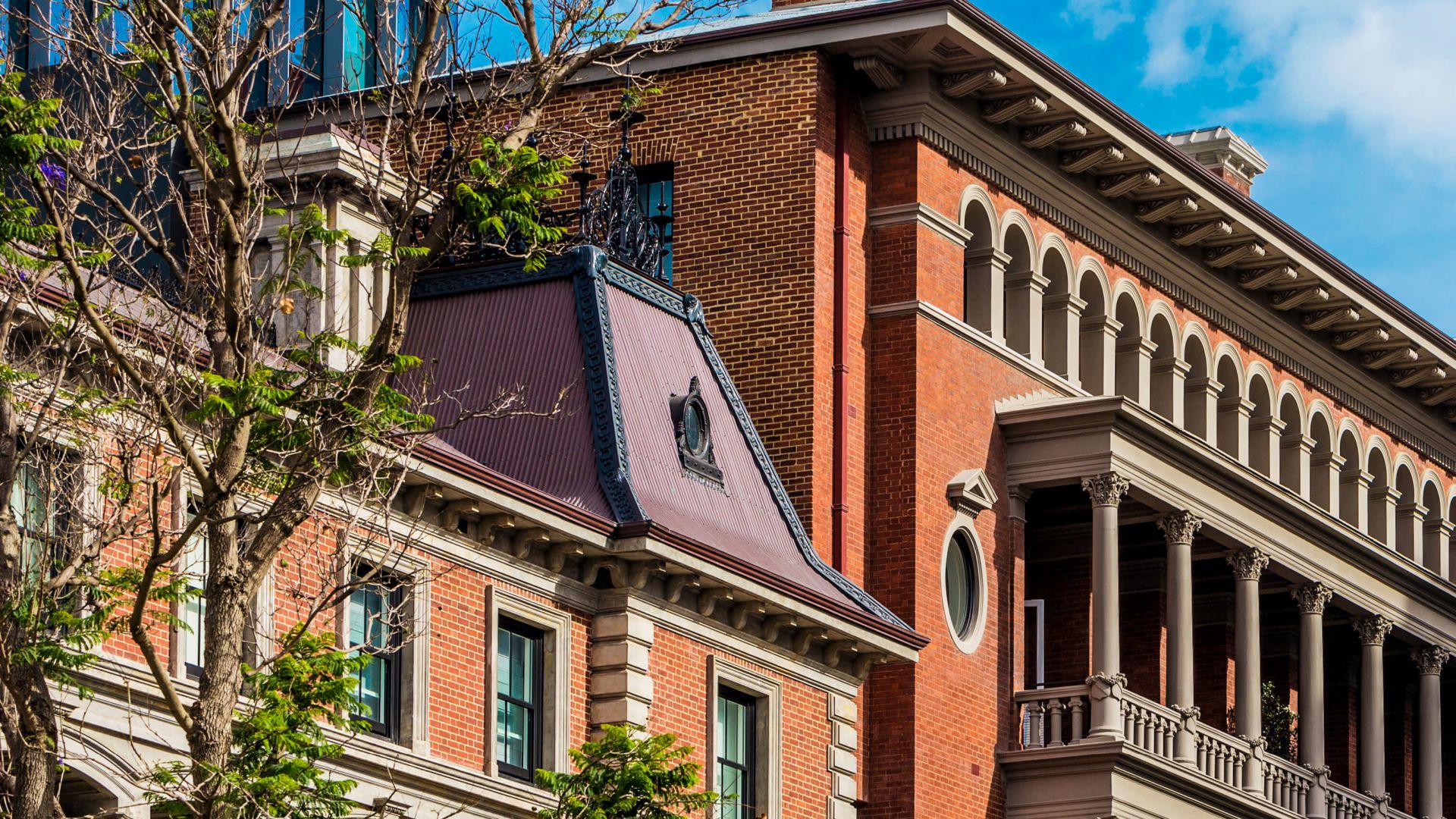 Heritage red brick facade of COMO The Treasury in Perth, home to COMO Shambhala Urban Escape spa