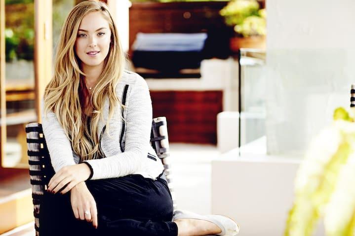 Jessica Sepel, nutritionist and health blogger, in a wellness setting with natural skincare products