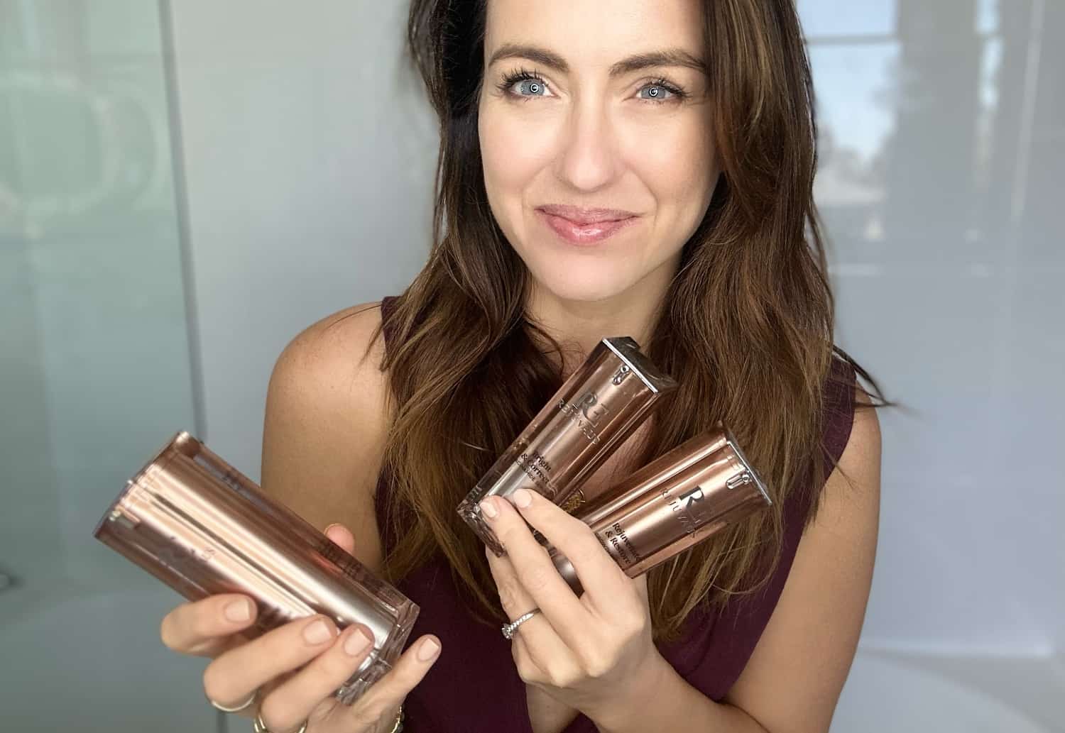 Woman displaying clear, glowing skin after eight-week skincare routine with professional-grade products