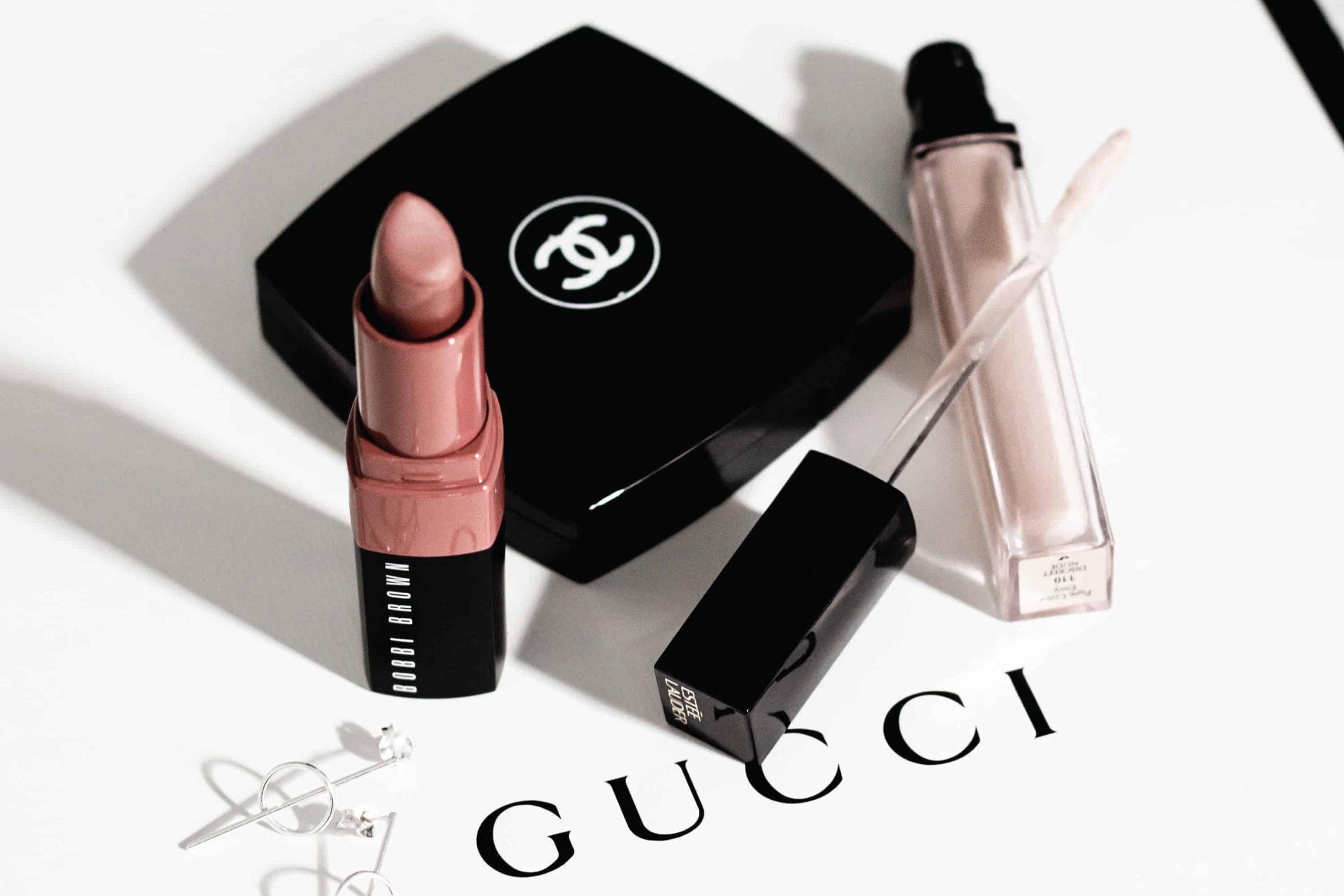 Model wearing peachy pink blush with coral lipstick, demonstrating complementary blush and lip colour pairing