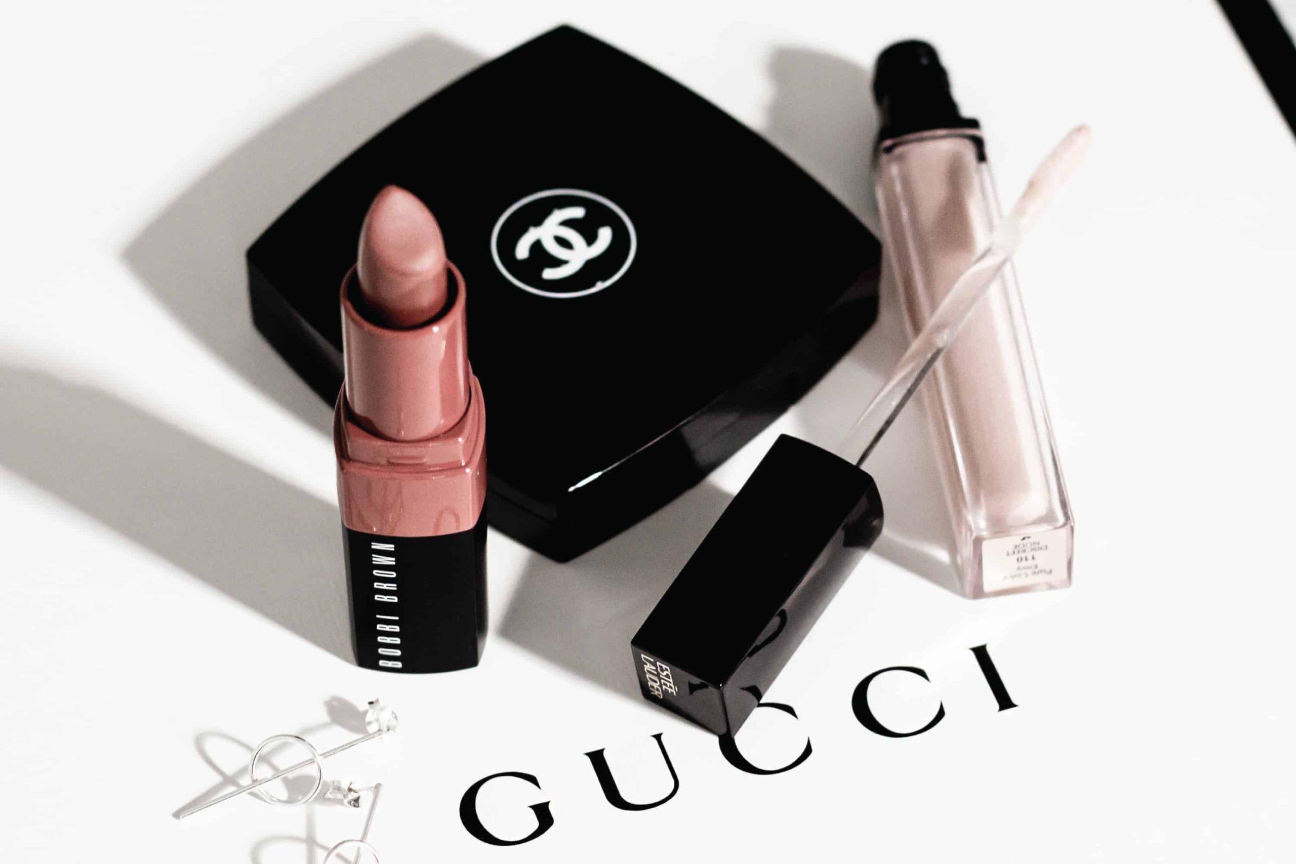 Model wearing peachy pink blush with coral lipstick, demonstrating complementary blush and lip colour pairing