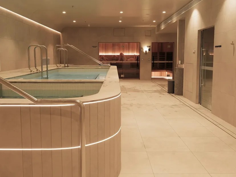 Magnesium pool beside timber-lined saunas and a steam room at CHANGE Wellness, North Adelaide