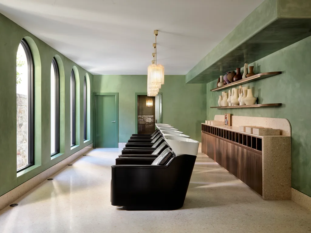 Modern minimalist salon interior with mirrored walls, monochrome tones and professional styling stations