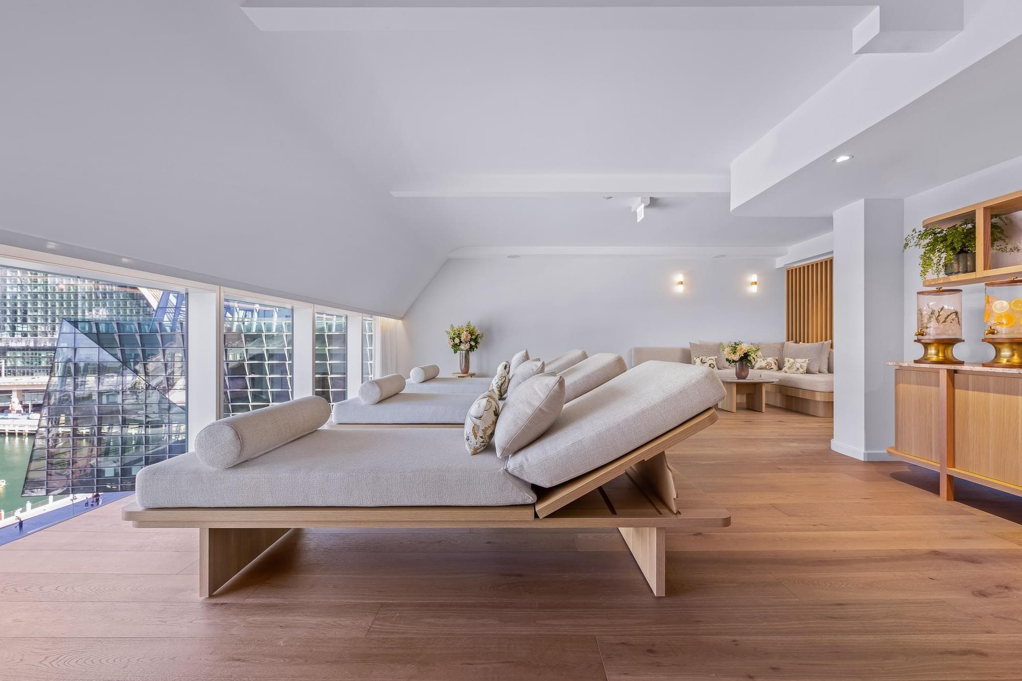 Luxurious spa treatment room with marble finishes, soft timbers, and views overlooking Darling Harbour