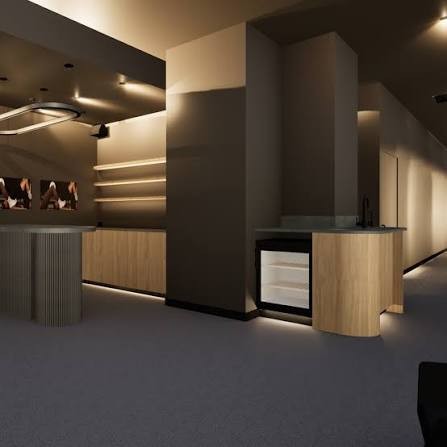 Dimly lit lounge with timber joinery and a curved reception counter at Power Moves, Newstead