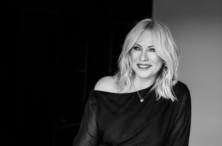 Kerri-Anne Kennerley in a bright, colourful outfit from her wardrobe, smiling at the camera