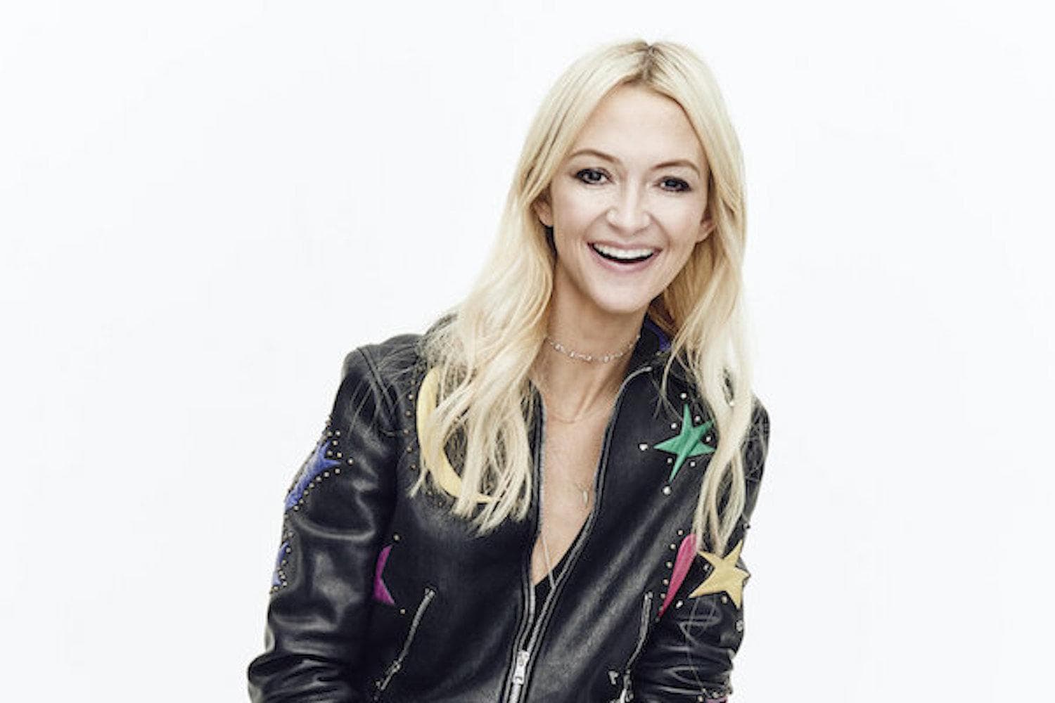 Zanna Roberts Rassi in a beauty setting, showcasing skincare and makeup products from her Milk Makeup line