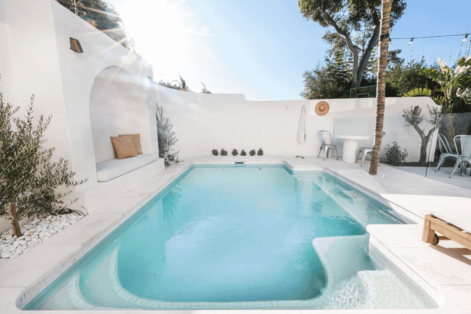 Luxury curved pool with tiled interior and sunken lounge at an Australian home