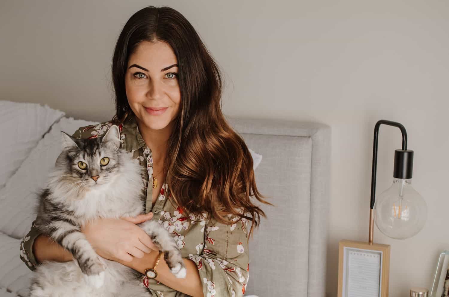 Beauty and lifestyle journalist Leigh Campbell at home holding her cat, for Beautiful Inside by Beauticate