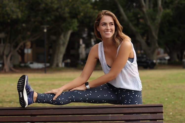  sigourney wears The Upside mirada yoga pant and adidas ultraboost x shoes with apple watch with white band 
