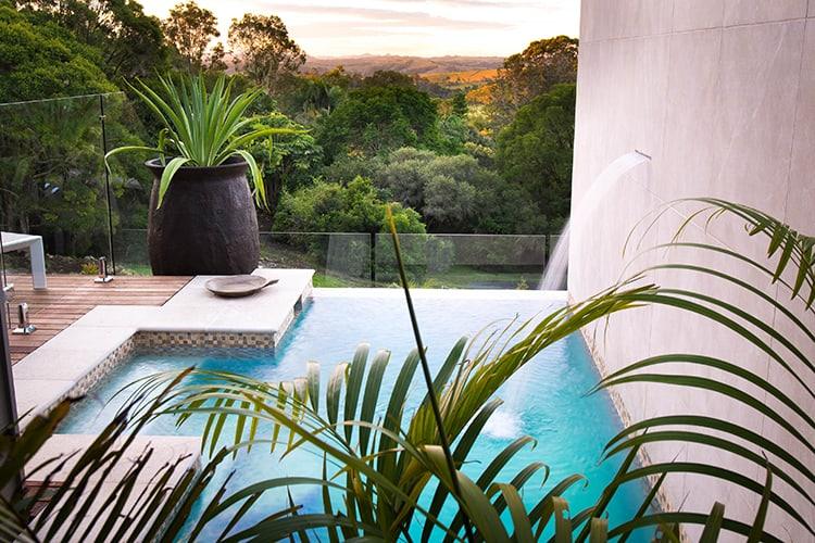 The villa plunge pool at sunset overlooking the tropical gardens