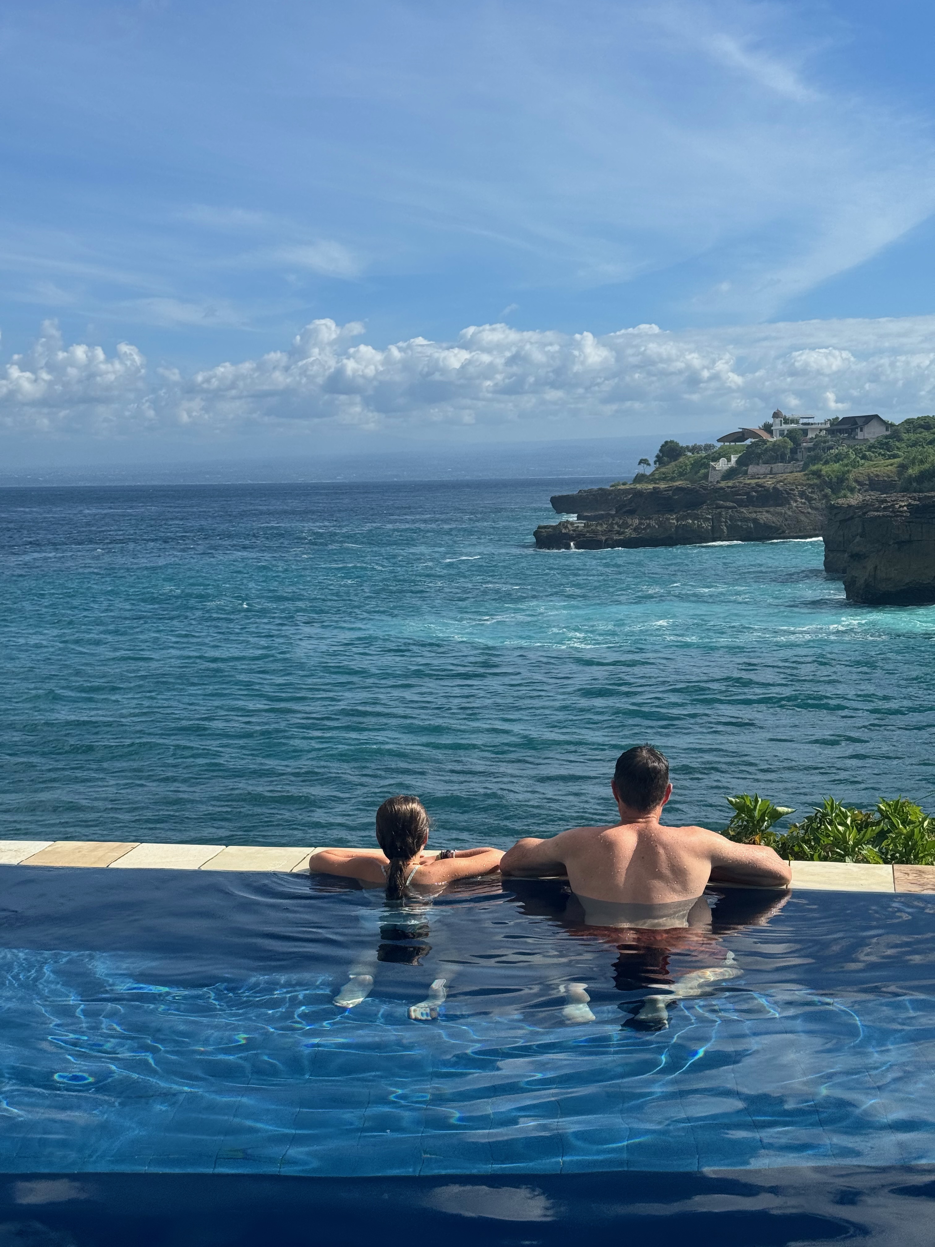 Damien and Lulu in the Villa Tranquilla infinity pool — that view