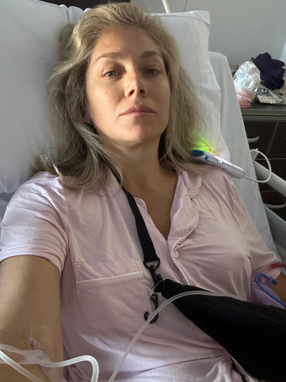 Colette preparing her hospital bag ahead of double mastectomy surgery, including comfort essentials and skincare